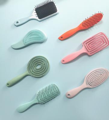 China Home Plastic Straight Curly Hair Brush Mini Handle Hair Brush With Paddle For Kids for sale