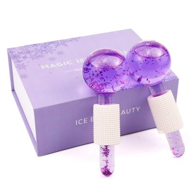 China Beauty Cold Or Hot Glitter Globe Massagers OEM Skin Massage Ice Glass Facial Globes With Foam Holder for sale