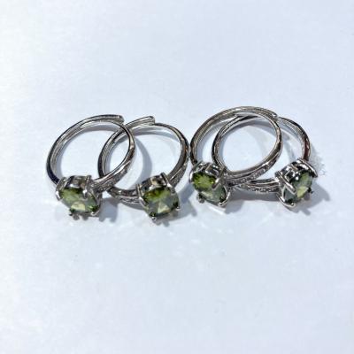 China Original Natural Green Polished Olivine Raw Stone Pendant Mateiral New Engraved Women Crystal Ring For Wedding for sale