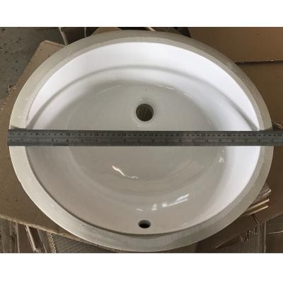 China Modern White Porcelain Countertop Oval Sink Modern Under Counter Bathroom Basin for sale