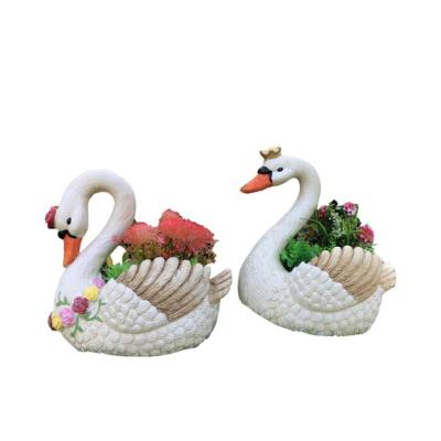 China Large Eco-friendly Bulk Resin Swan Flower Pot Outdoor Garden Lawn Flower Pots for sale