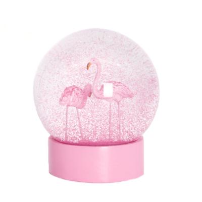 China Global Originality Wholesale Pink Glitter Resin Water Globe Factory Customized Flamingo Glass Globe For Home Decor Indoor Souvenirs for sale