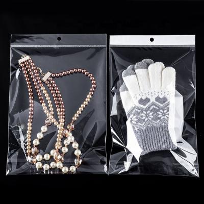 China Customized OPP Transparent Seal Moisture Proof Adhesive Jewelry Plastic Bags With Header for sale