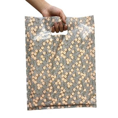 China 2023 Custom Moisture Proof Logo Design Printed LDPE Die Cut Plastic Handle Bag for sale