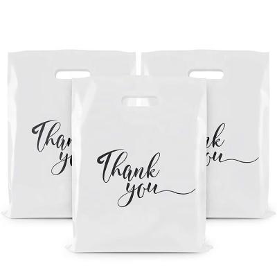 China Yiwu Factory Moisture Proof Handle Die Cut Plastic Shopping Bag for sale