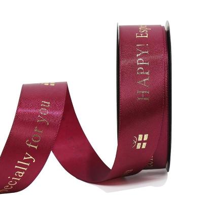 China Viable Wholesale Custom Logo Polyester Gold Foil Satin Ribbon For Wrapping Decoration for sale