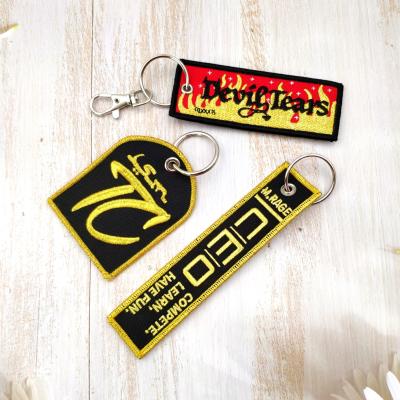 China 2021 Eco-friendly Logo Fabric Keyring Key Tag Embroidery Gold Customs Key Chain for sale