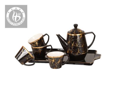 China Viable Custom Decorative Black Gold Porcelain Tea Cup And Saucer Ceramic Decal Logo Set for sale