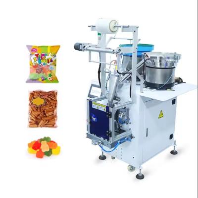 China Kleine Gummy Candy Verpackungsmaschine Süßwaren Kaugummi Verpackungsmaschine Lollipops Candy Bar Verpackungsmaschine zu verkaufen