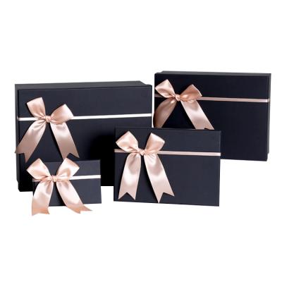 China Recycled Materials Mutli Size Paper Package Gift Custom Cosmetic Paper Box With Ribbon Bow for sale