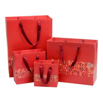 China Red Color Biodegradable Chinese Wedding Printed Cardboard Gift Shopping Red Paper Bags With Handles for sale