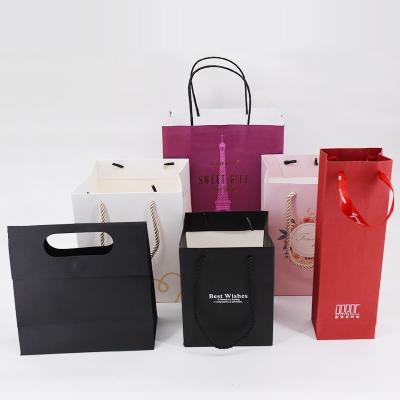 China Luxury Handmade Jewelry Packaging Black Paper Bags Printed Logo Custom Paper Bag Shopping Gift Jewelry Packaging for sale