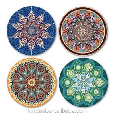 China Sustainable set of 4 round ceramic coasters in blue and white floral prints for sale