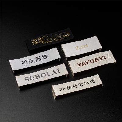 China Washable Clothing Labels Embroidery Patches Iron On Badges Labels Steel Clothing Luxury Brand Label for sale