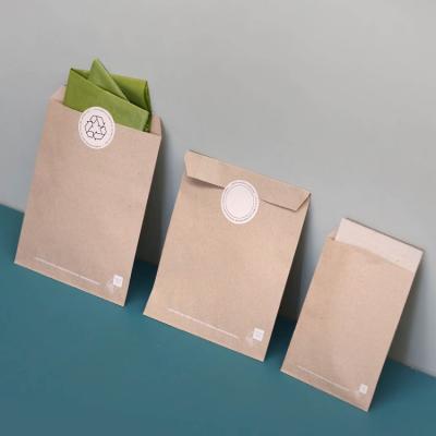 China Small Paper Retail Stores Packaging Paper Gift Bag Christmas Paper Craft Paper Mailing Bag Custom Self Adhesive Postal Bag Prices For Clothing for sale