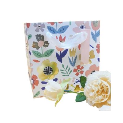 China Bio-degradable Mini paper bags with ribbon paper bag for gift flower gift bag for sale