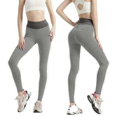 China Breathable gym fitness yoga pants with version acrylic cellular hip peach polyester network lifting stovepipe for sale