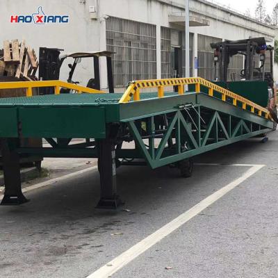 China Logistics Center Portable Forklift Ramp 10T Hydraulic Ramp For Container Unloading for sale