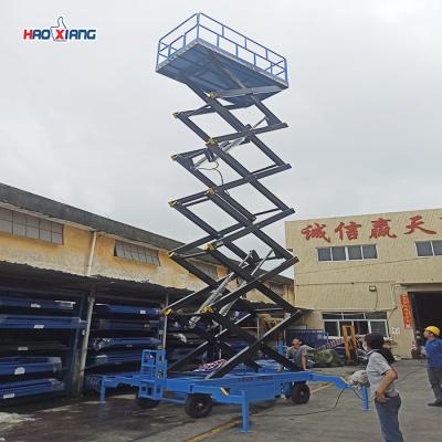 China 300kg-1500kg Mobile Scissor Lift Platform With Solid Tires And AC DC Power for sale