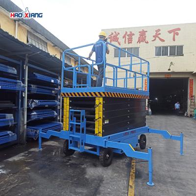 China 1000Lbs Electric Hydraulic Scissor Lift Table Blue Motorized Hydraulic Lift for sale