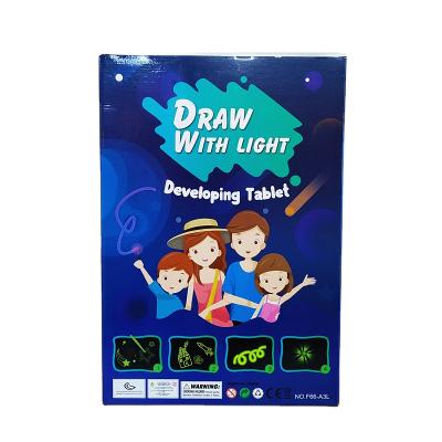 China 2022 New Product Kids Paper Education Toy Noctilucent Pen Writing Paint Set A4 Toy Night Magic Light Drawing Board For Children for sale