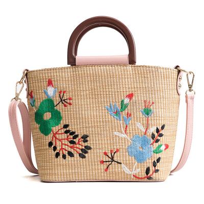 China 2021 Fashion Embroidery Flower Rattan Tote Bag Straw Beach Handbags Portable Tide Shoulder Bag for sale