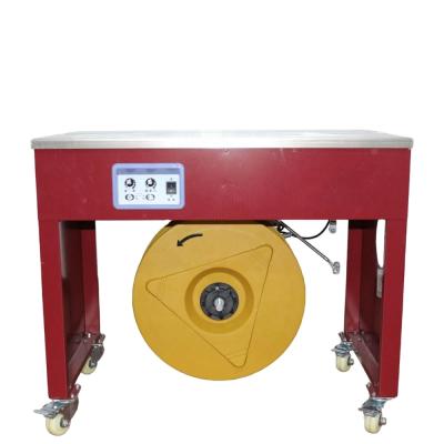 China Semi-automatic Table Top Automatic Food Poly Box Carton Package PP Belt Tying Machine for sale