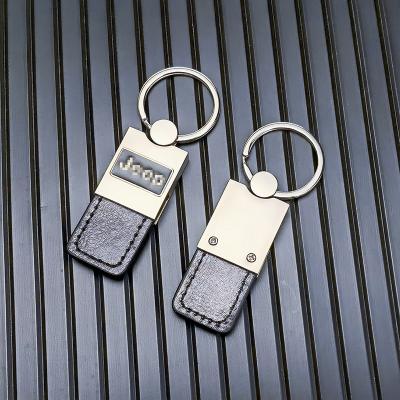 China Metal + PU gift promotional item cheap price suitable for jeep metal and leather key chain key ring for sale