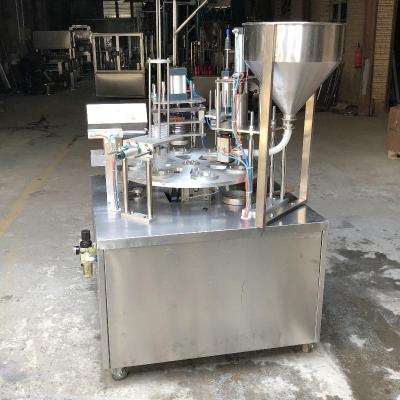 China Small Rotary Type Water Cup Food Juice / Liquid Milk Cup Filling Sealing Machine for sale