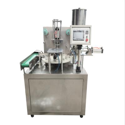 中国 Small Rotary Type Water Cup Food Juice / Liquid Milk Cup Filling Sealing Machine 販売のため