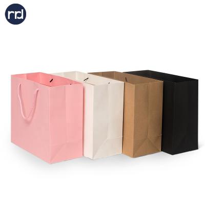 China RR Donnelley 2021 Recyclable Art Paper Cheap Cloth Bag Custom Packaging Bags White With Handle Logo for sale