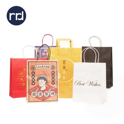 China Recyclable Wholesale Bulk RR Donnelley Gift Bags Kraft Paper Bag For Shopping With Handle for sale