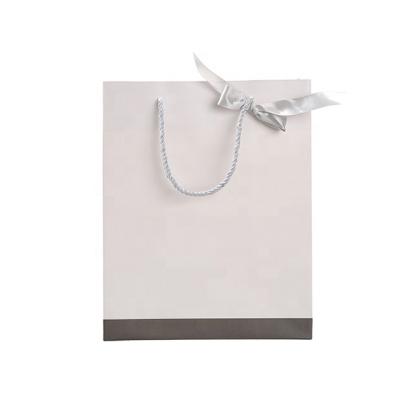 China RR Donnelley Recyclable High End Style New Logo Print Custom Gift Bags For Shopping With Handle for sale