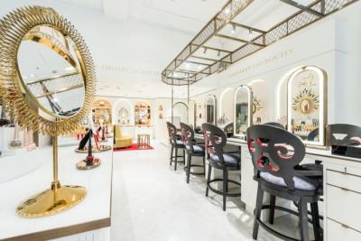 China Luxury fashion Makeup store interior fit outs by wooden Ivory counters with Bronzed metal craft display Showcase for sale