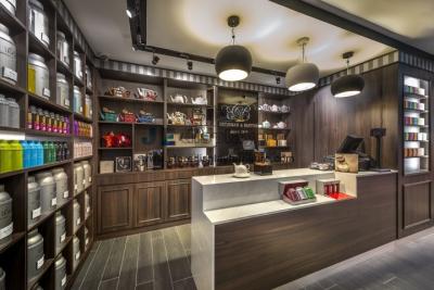 China Chinese Tea shop fits out Dark Walnut solid wood in-Wall cabinets with Shelves and reception counters for sale