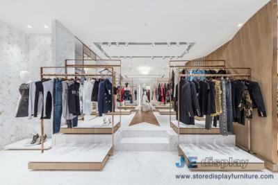 China Los estantes de exhibición del acero inoxidable del diseño de la tienda de ropa de la marca de la moda con los estantes y los muebles del ocio de la recepción acuestan en venta