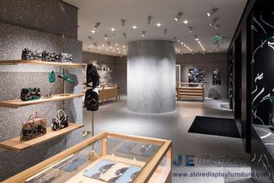 China Los contadores de la exhibición de la joyería del roble del diseño de la tienda de la ropa de las mujeres de gama alta y el paño de pared de madera de la caída deja de lado con los estantes en venta