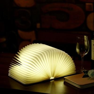 China Modern Customized Wooden Grain PU Folding 6 Colors Placing Mini Book Lamp Led Book Lamp Light for sale