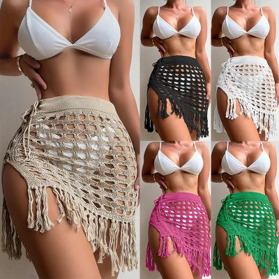 China Antibacterial Women's Beachwear Sexy Perspective Hollowed Out Skirt Girl's Knitted Split Beach Degree Tassel Swimwear for sale