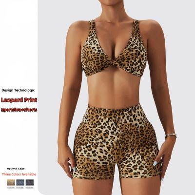 China Newetty Breathable Sports Fitness&yoga Suit Leopard Print Women Gym Fitness Set Sexy Cross Crystalp 2 Piece Sportswear Plus Nylon Spandex for sale