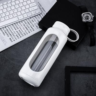 China Newest Design Sustainable Good Quality Cylinder Glass Water Bottle With Plastic Sleeve for sale