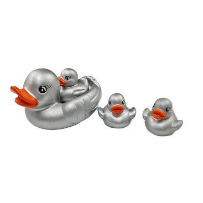 China Cute Eco-Friendly Rubber Baby Bath Toy Float and Squeak 4Pcs Duck Shower Toys Family Pack for Kids Bath Duck Toys for sale