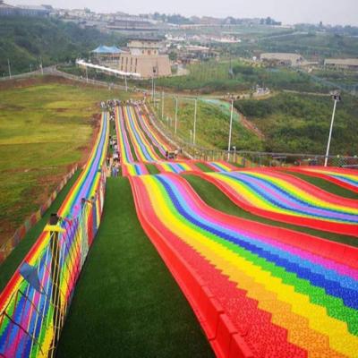 China Theme Park Colorful Dry Slide Kids Plastic Rainbow Slide For Sale for sale