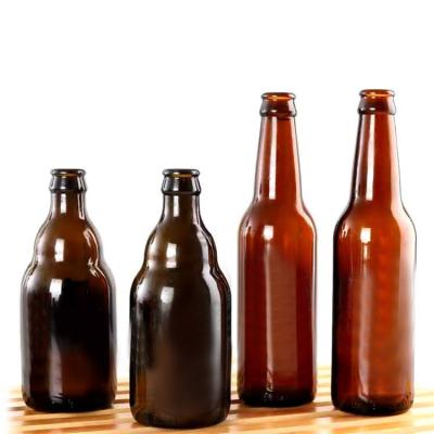 China Custom clear logo 330ml 500ml storage mask glass beer bottles with cap in stock, amber glass bottle for beer for sale