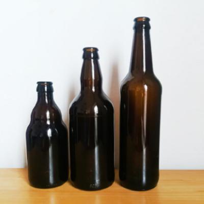 China Dark 330ml 500ml 600ml 1000ml Amber Glass Empty Refillable Beer Glass Food Bottles With Crown Cap for sale