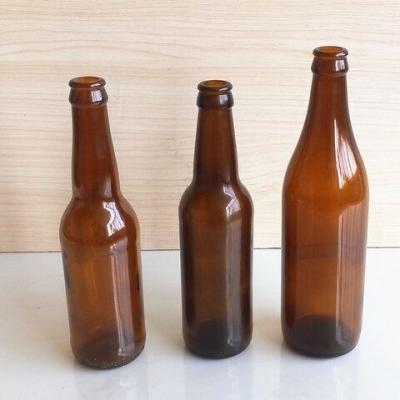 China Fashionable custom beer glass bottle clear / green / amber glass beer bottle price cheap bottle 330ml 500ml for sale