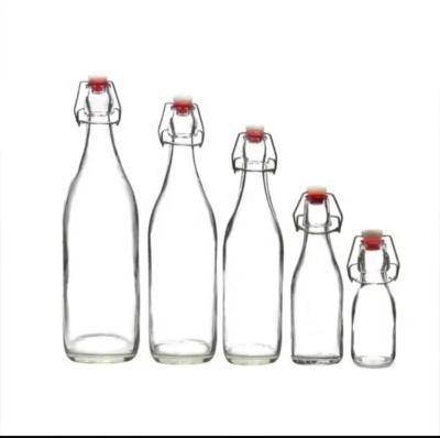 China Factory Customized Top Swing Glass Cap Bottle Liquor Liquor Bottle Personal Care Beer Bottle for sale