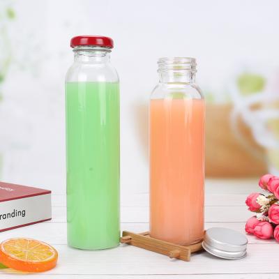 China Eco - Friendly Recyclable Round Glass Beverage Bottles Food Grade Beverage Container With Lid for sale