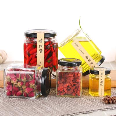 China 200ml transparent cylindrical glass food jar with screw cap metal for sale