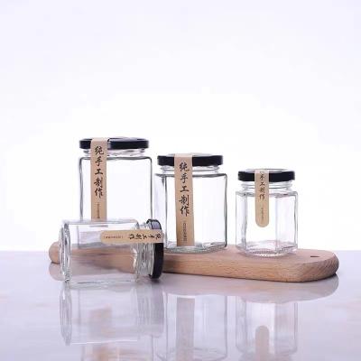 China Wholesale Mini 50ml 200ml Round Food Restaurant Glass Bottle Glass Hexagon Jar for sale